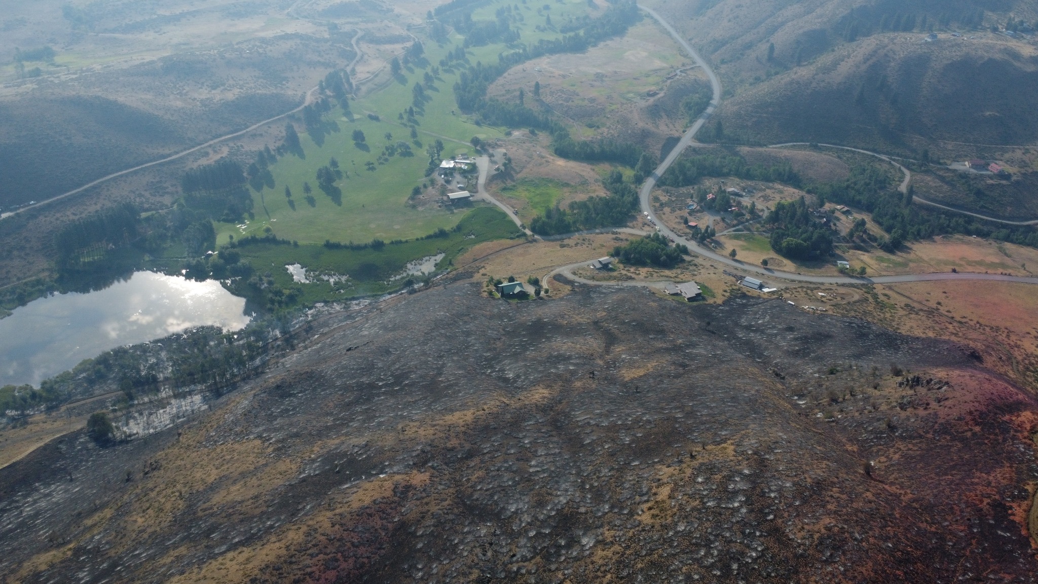 Fire to edge of houses